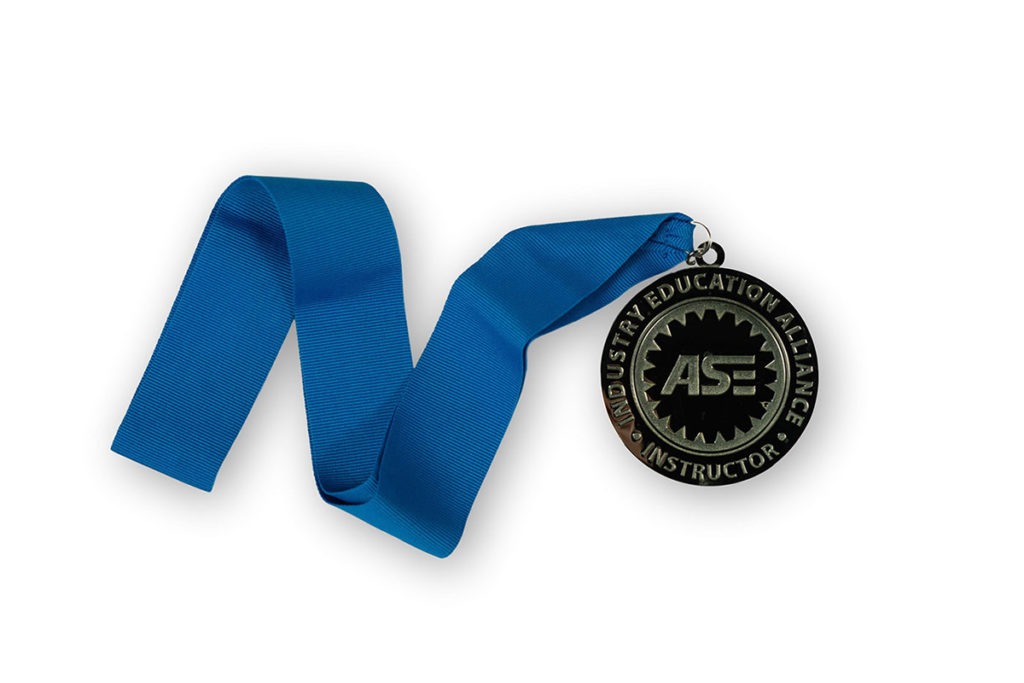 Product Shot of an ASE Medal for an Industry Education Alliance Instructor