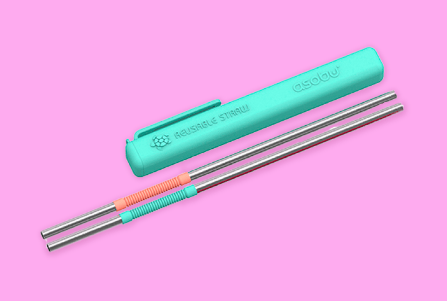 Reusable orange and teal metal straws on a pink background