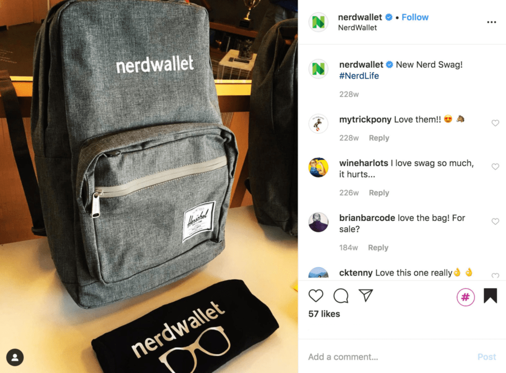 Nerd Wallet black t-shirt and gray backpack